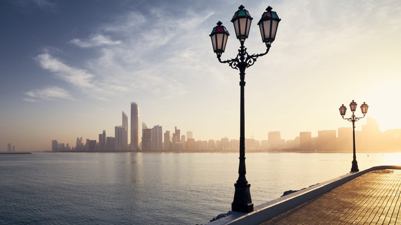 Urban skyline with skyscrapers at beautiful sunrise. Cityscape Abu Dhabi, United Arab Emirates.