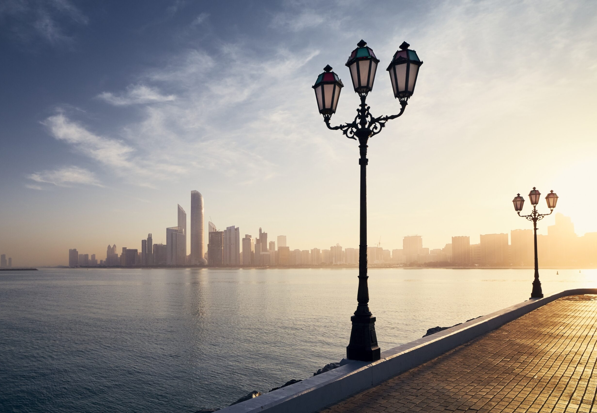 Urban skyline with skyscrapers at beautiful sunrise. Cityscape Abu Dhabi, United Arab Emirates.